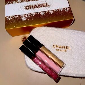 Chanel lip gloss trio and makeup case.